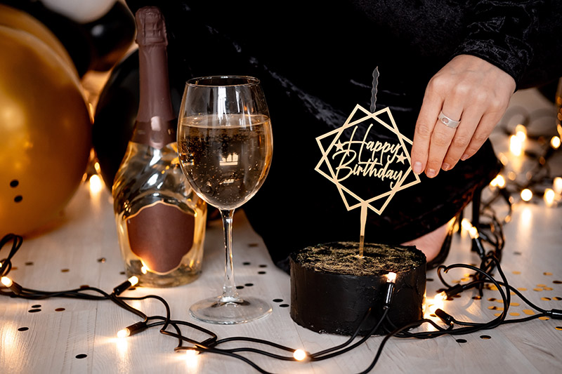 In-suite birthday celebration with cake, champagne, and custom décor